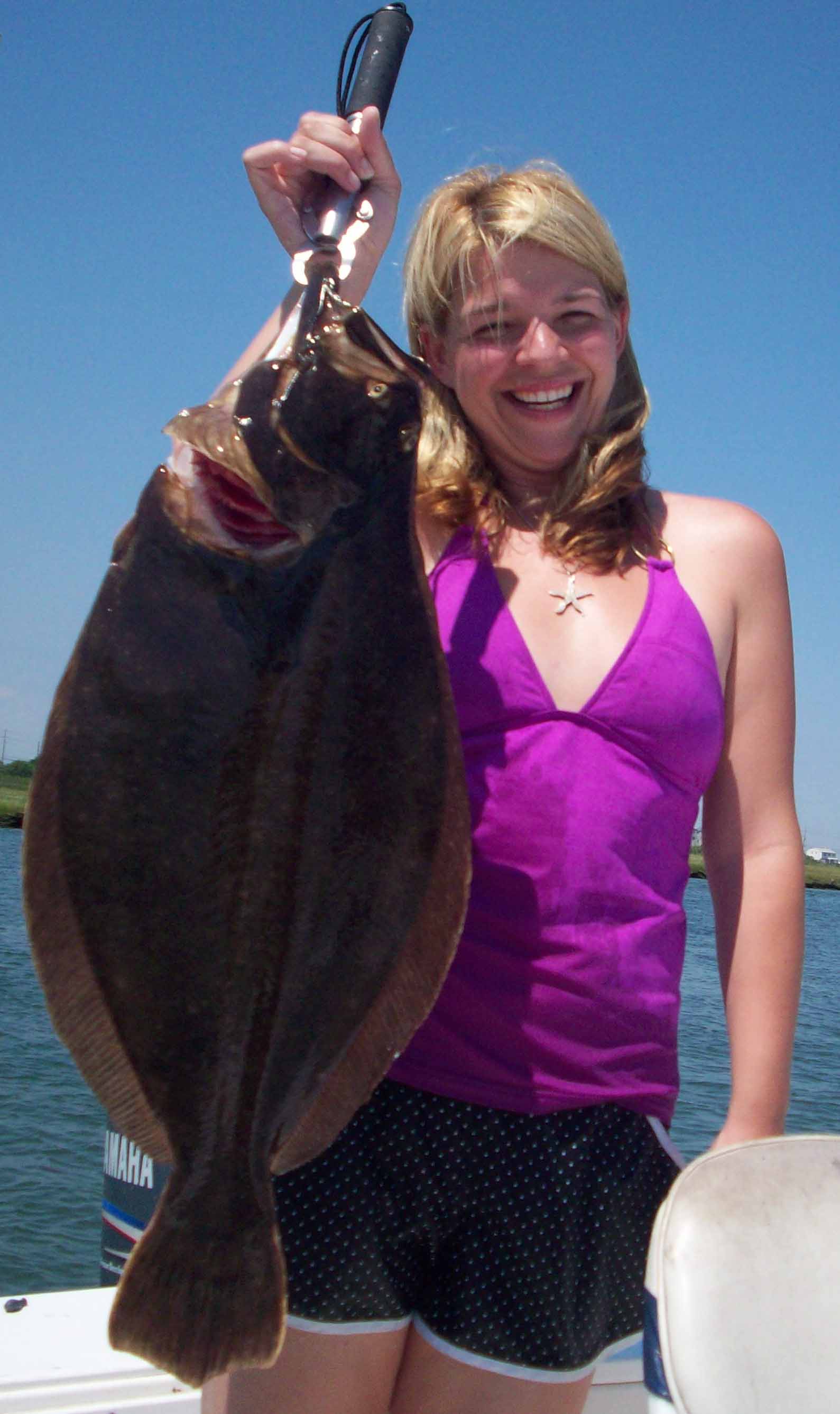 Large doormat flounder are caught aboard Time Out Charters