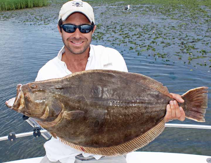 Flounder fishing charters can catch doormats like this 11.5 lb fluke with Captain Scott Newhall near Atlantic City.